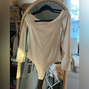 Nuuds off the shoulder bodysuit in the color bone.